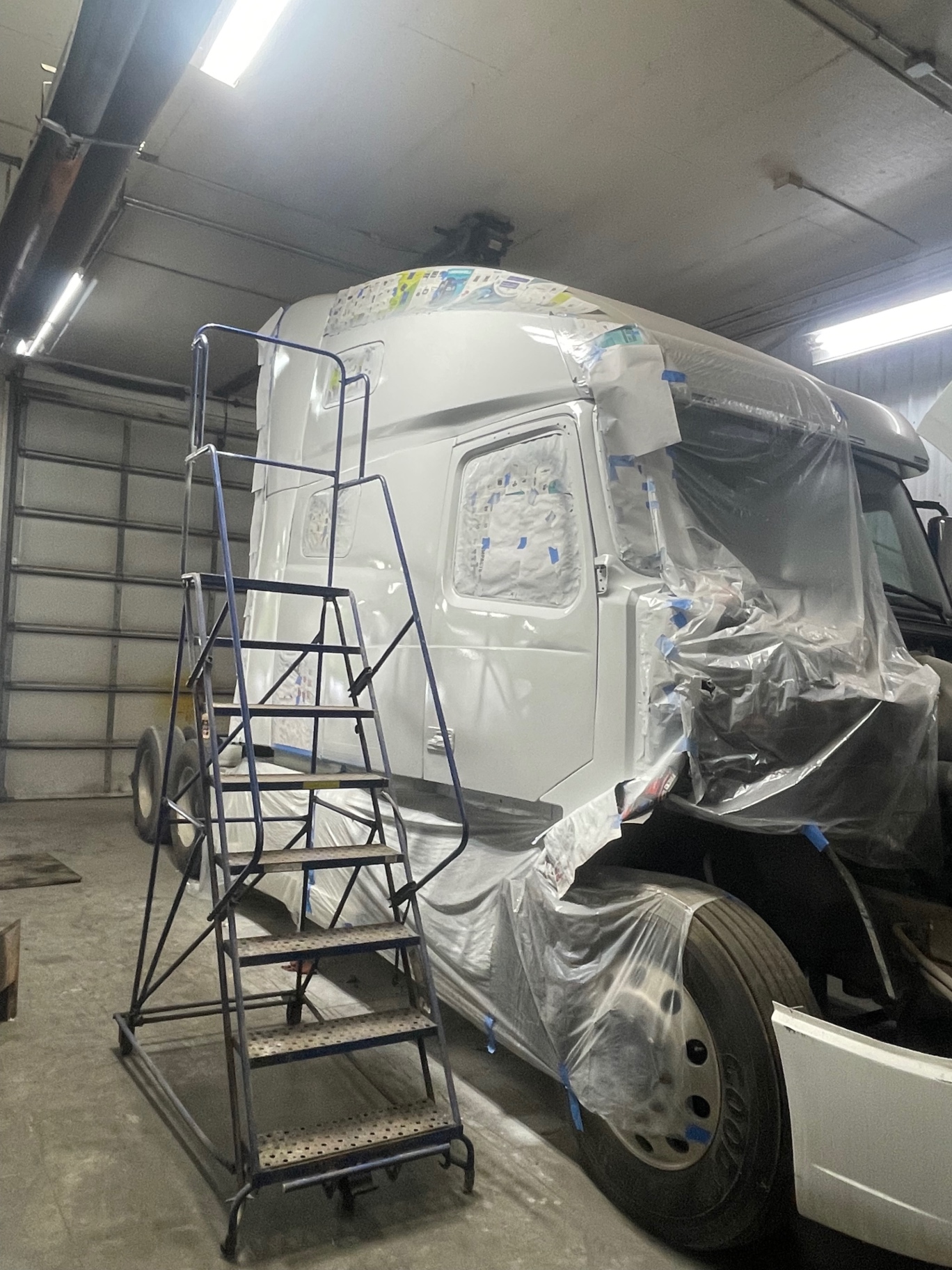 Volvo VNL cab masked and prepped for paint