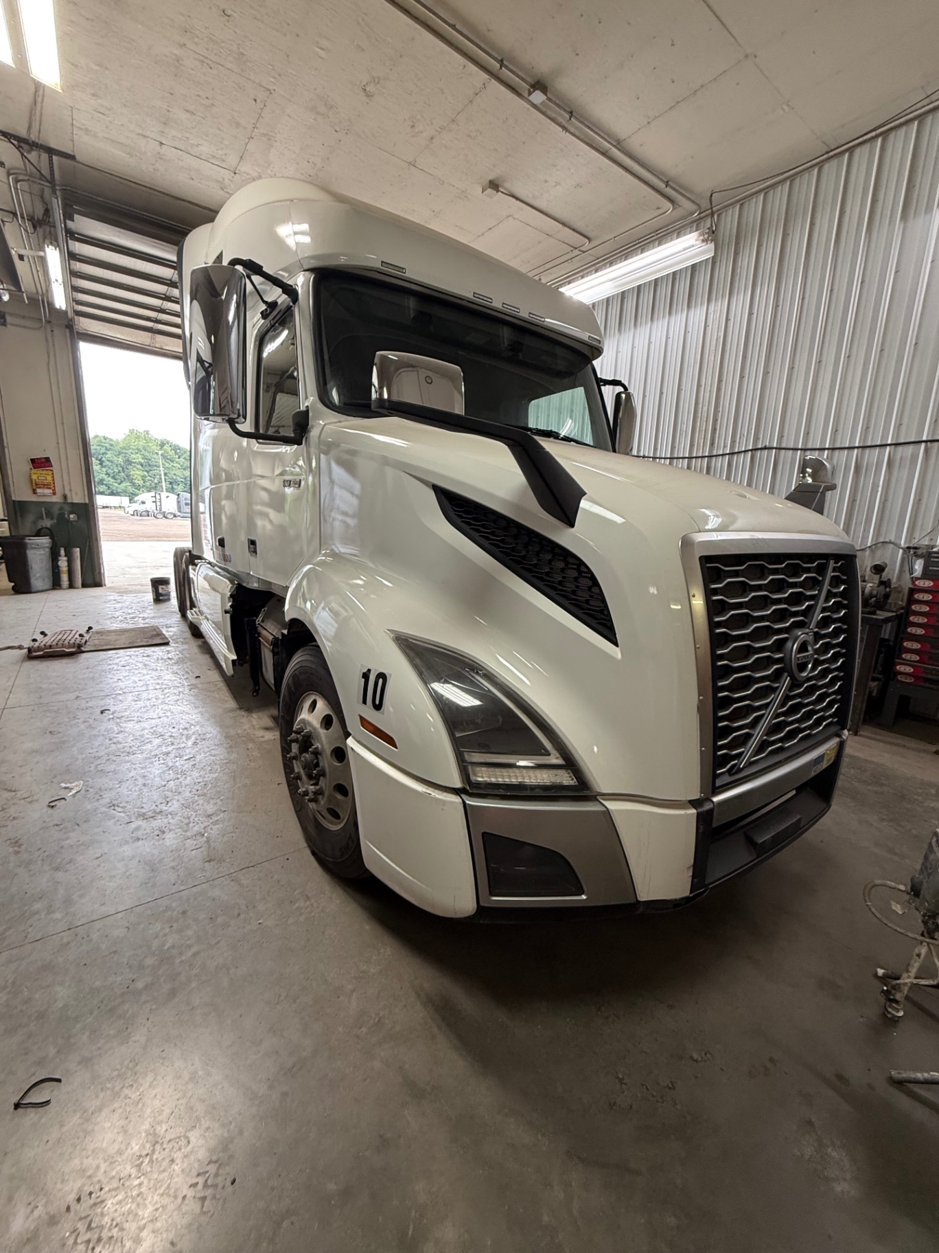 Restored white Volvo VNL after a full rebuild at M&Q